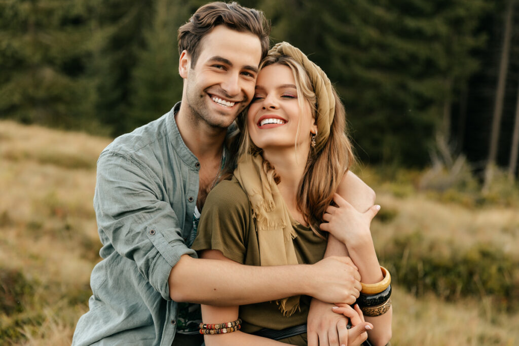 Loving,Young,Couple,Hugging,And,Smiling,Together,On,Nature,Background.